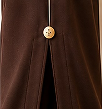 Side slit finished with the brushed gold SYA button.